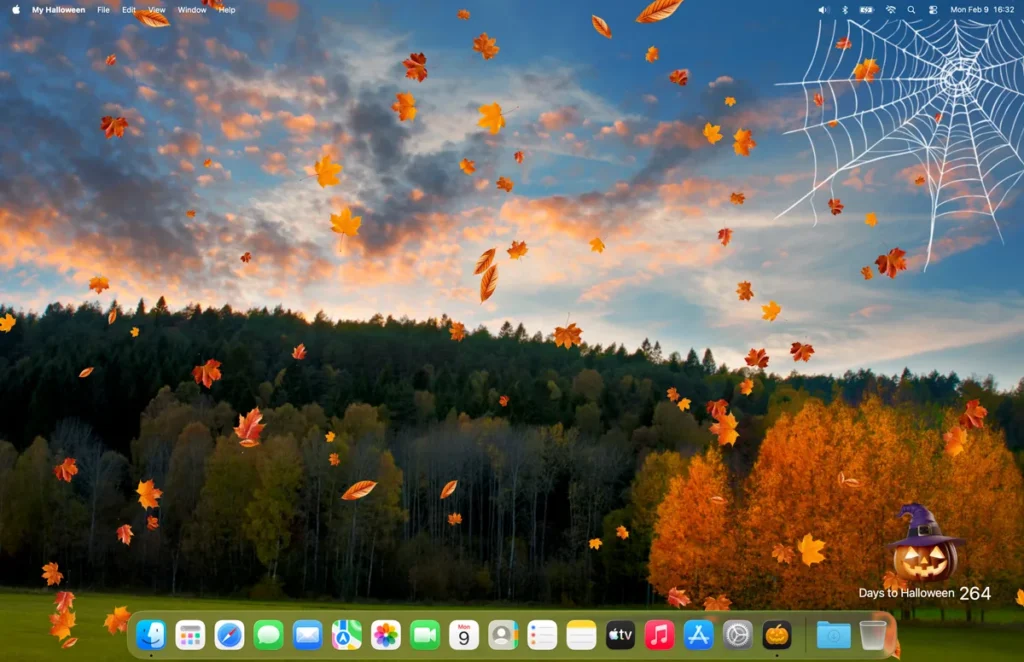 Mac desktop with My Halloween Countdown app has falling tree leaves and a spider web in the top right corner, and a scary pumpkin